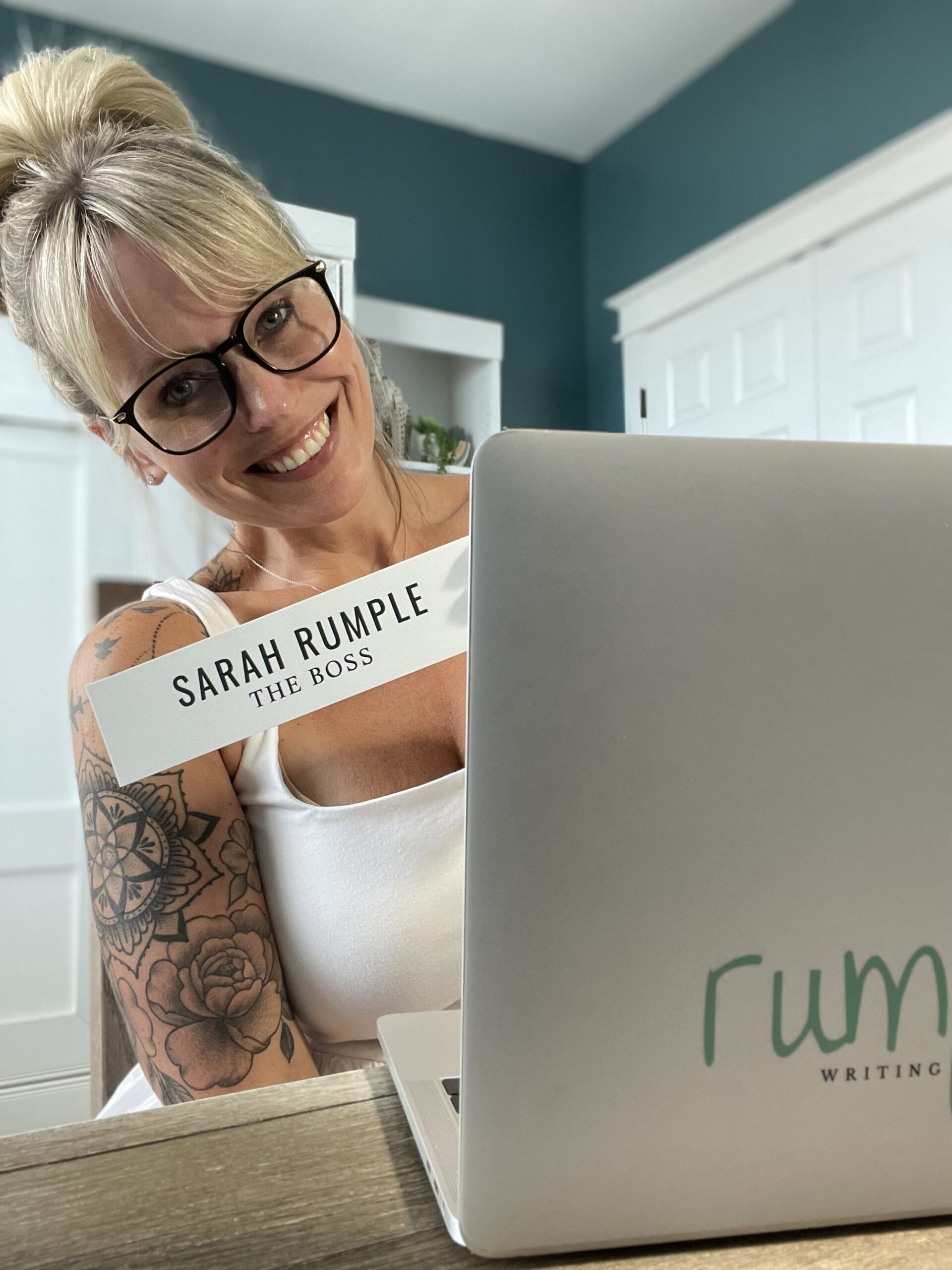 Sarah Rumple at her laptop as the business owner of Rumpus Writing and Editing